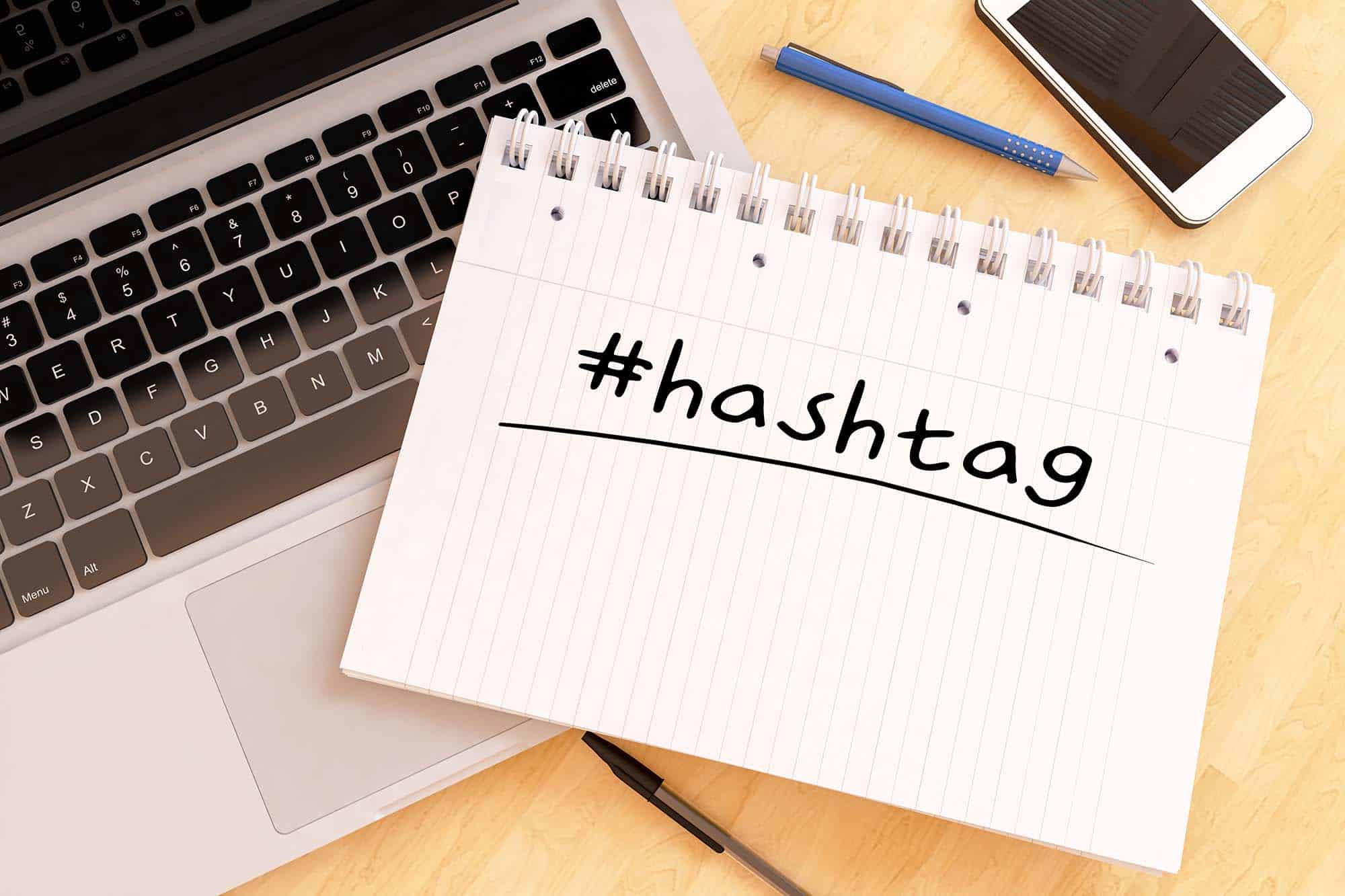 Hashtag - handwritten text in a notebook on a desk - 3d render illustration.